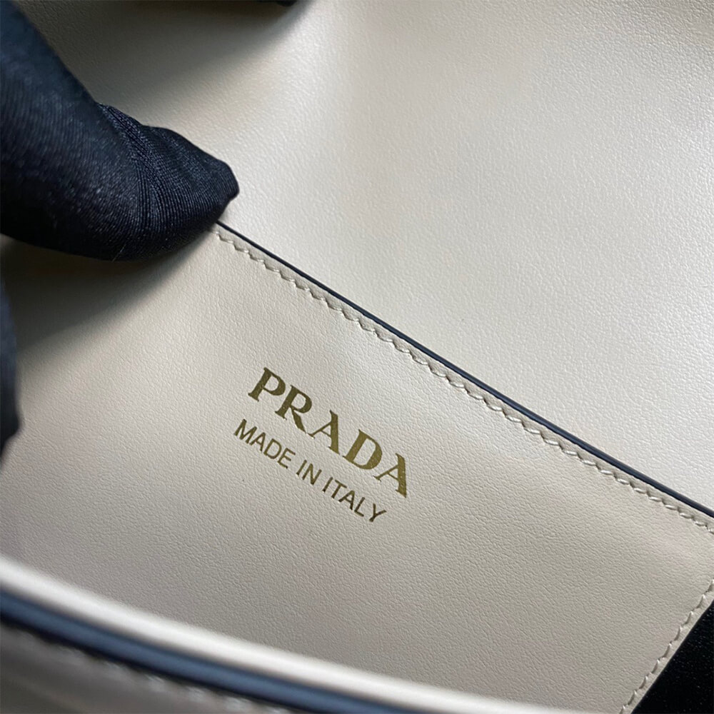 Pra*a Arque leather shoulder bag with flap