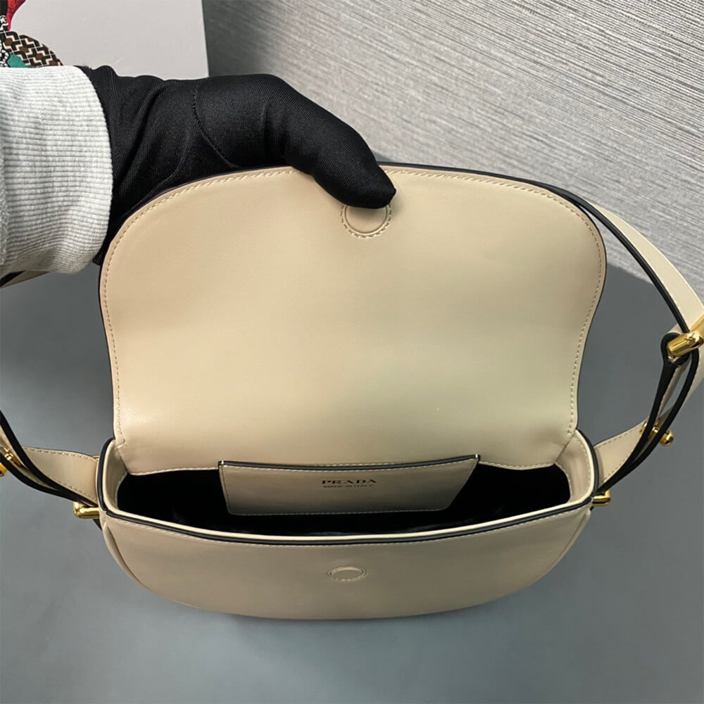 Pra*a Arque leather shoulder bag with flap