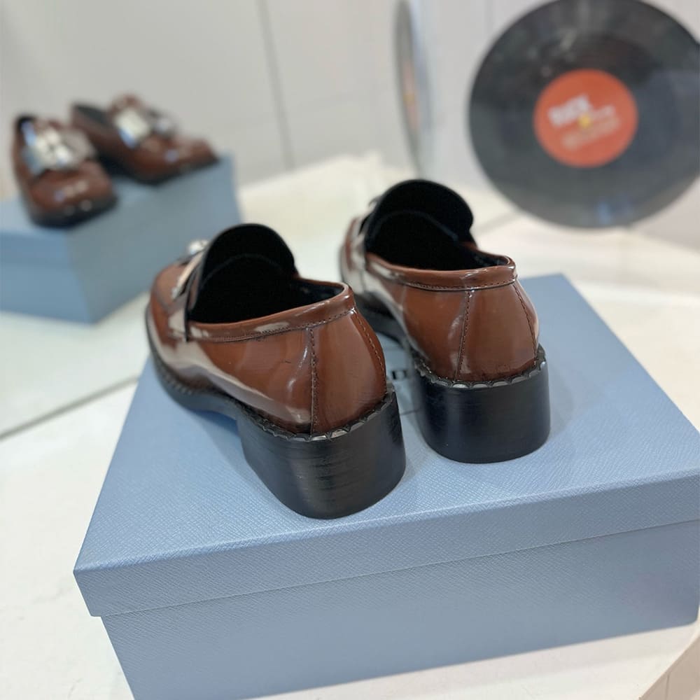 Pra*a Brushed leather loafers with metal details